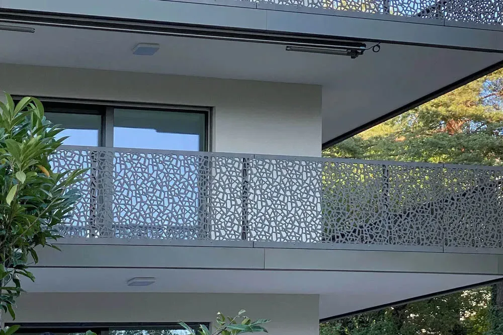 Contemporary cantilevered balcony design with steel and wood details—modern luxury architecture for hilltop farmhouses in Coimbatore.