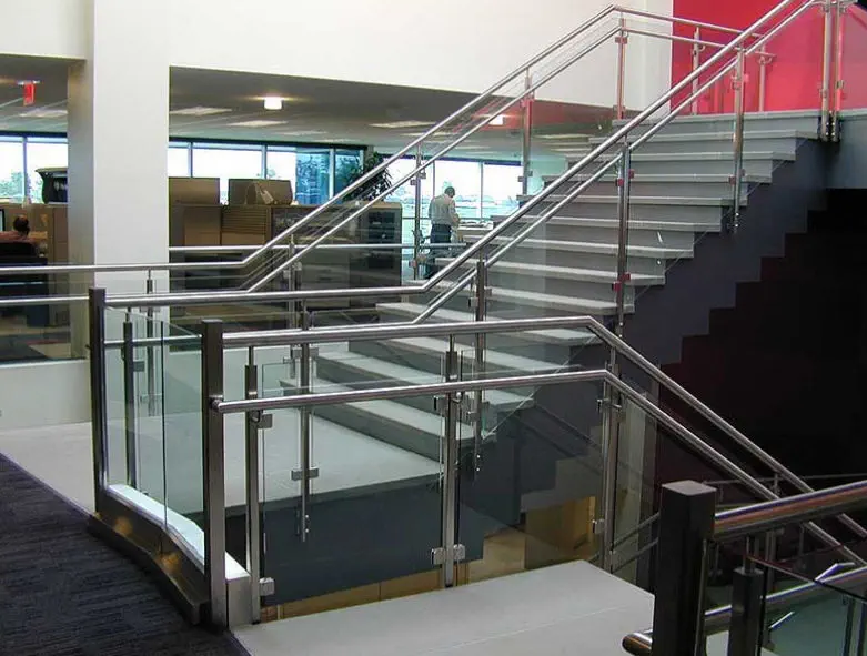 Modern industrial farmhouse staircase with polished concrete treads and minimalist black steel stringers—contemporary home design in Attappadi.