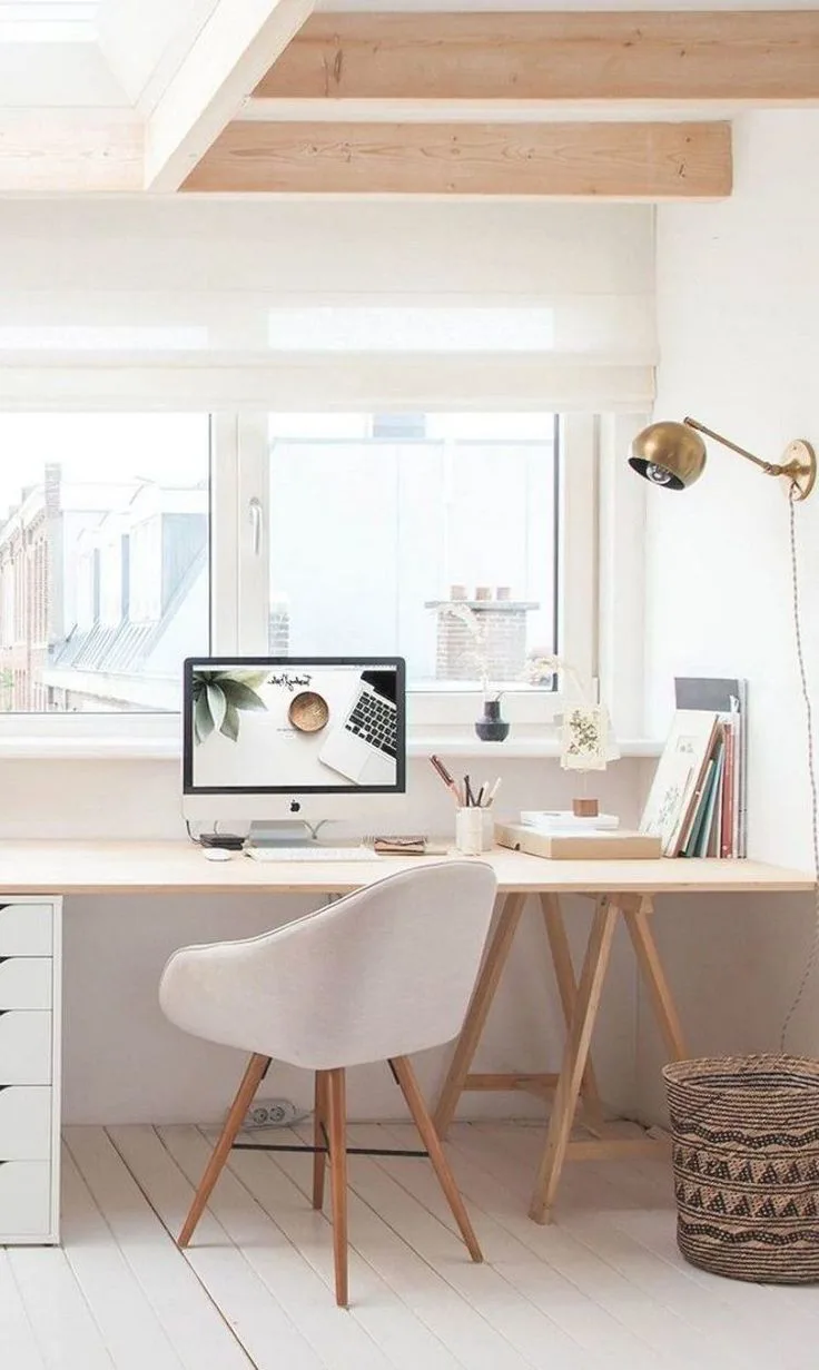 Minimalist Zen study room with light oak furniture, indoor plants, and a clean white aesthetic—modern NRI office space in Narasimukku.